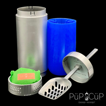 Patented PÜP SCÜP™ pet litter scoop containment system showing all components: a silver plastic outer container with a locking lid to deter misuse, a removable blue silicone inner cleaning cylinder, a metal scoop with an affixed plastic hand-shielding lid, and a locking plastic bottom vented cavity with a premium charcoal odor control bag.